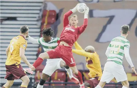  ??  ?? Motherwell’s former Sunderland and Hartlepool United keeper, Trevor Carson, gathers a high ball against Celtic.