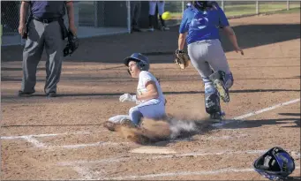  ?? Jesse Munoz/COC Sports Informatio­n ?? College of the Canyons freshman Rena Edwards slides into home plate during the first inning of the Cougars’ 15-3 win over West L.A. College at Whitten Field on Thursday.
