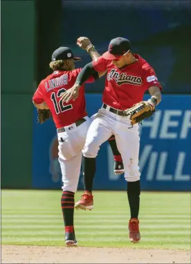  ?? PHIL LONG — THE ASSOCIATED PRESS ?? The Indians’ Francisco Lindor and Oscar Mercado celebrate their win over the Angels on Aug. 4 at Progressiv­e Field.