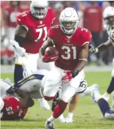  ?? RICK SCUTERI/AP ?? In 2016, Cardinals running back David Johnson led the league with 2,118 yards from scrimmage and 20 total touchdowns.
