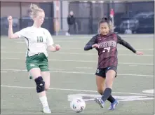  ?? Mark Ross/Special to the Herald-Leader ?? Siloam Springs’ Rin Bos (right) goes after a ball against Alma’s Abigale Carter during a game March 14 at Panther Stadium.