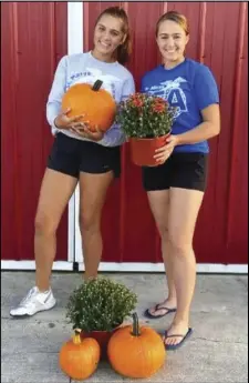  ?? Photo provided ?? Sisters Charley (left) and Lucy Spencer teamed up to sell mums and pumpkins to get St. Marians into the fall spirit.