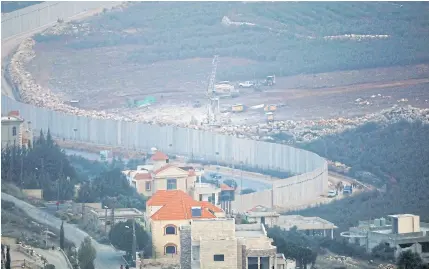  ?? REUTERS ?? Israeli drilling equipment is seen next to the Lebanese village of Kfar Kila, near the border, last month.