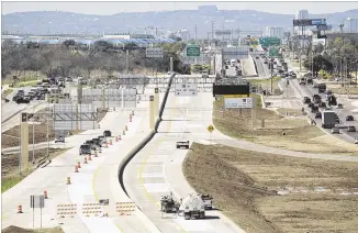  ?? JAY JANNER / AMERICAN-STATESMAN ?? Starting sometime Tuesday, probably just before the evening rush hour, highway crews will remove cones and other barriers and open the 3-mile-long Texas 71 tollway.