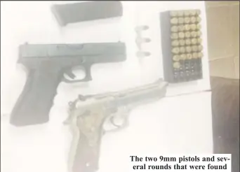  ??  ?? The two 9mm pistols and several rounds that were found