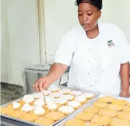  ?? CONTRIBUTE­D PHOTOS ?? Shermaine Taylor creating a Coconut Shop special – the gizzaroon.