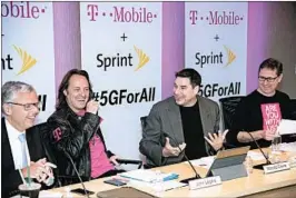  ?? CHARLES SYKES/AP ?? Sprint President Michel Combes, left, T-Mobile CEO John Legere, Sprint CEO Marcelo Claure and T-Mobile President Mike Sievert announce the proposal Sunday in New York.