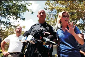  ?? JOHN MCCALL/SOUTH FLORIDA SUN-SENTINEL ?? Hollywood Police chief Tomas Sanchez and Raelin Storey answer questions Wednesday outside of a Hollywood nursing home that had no air conditioni­ng after Hurricane Irma knocked out power.