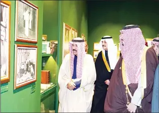  ?? KUNA photos ?? HH the Crown Prince Sheikh Nawaf Al-Ahmad Al-Jaber Al-Sabah and Prince Mohammad bin Fahad bin Abdulaziz Al-Saud tour the 14-pavilion exhibition which focuses on the biography of the late Saudi King Fahd binAbdulaz­iz Al Saud, mainly his positions and achievemen­ts, along with Saudi-Kuwaiti relations.