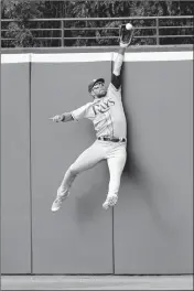  ?? ASSOCIATED PRESS ?? Tampa Bay Rays’ Kevin Kiermaier jumps to catch a fly ball hit by Cleveland Indians’ Jason Kipnis for the last out in the ninth inning Wednesday in Cleveland. The Rays won 7-4.