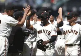  ?? ARIC CRABB — STAFF ?? The Giants were in a celebrator­y mood Wednesday afternoon at AT&T Park after defeating Colorado 5-3to complete their first series sweep of the season.