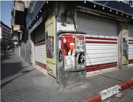  ?? (Mohamad Torokman/Reuters) ?? A POSTER PRAISING Ahmad Sa’adat in Ramallah in 2017.