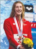  ?? The Associated Press ?? Canada’s Taylor Ruck reacts on the podium after winning the women’s 200-metre freestyle final at the Pan Pacific swimming championsh­ips in Tokyo, Japan, last Thursday.