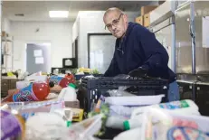  ??  ?? Filbert Baca, a disabled volunteer at Bienvenido­s Outreach, said he’s served the organizati­on for three and a half years. He volunteers 32 hours a week, helping feed lowincome families and homeless people. Some of the items he includes in the food baskets are soy milk, dried cherries, Brussels sprouts and eggs.