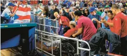  ?? DAVID SANTIAGO/MIAMI HERALD ?? Puerto Rico pitcher Edwin Diaz leaves in a wheelchair after a World Baseball Classic game against the Dominican Republic on Wednesday in Miami.