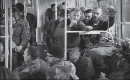  ?? ALEXEI ALEXANDROV/AP ?? UKRAINIAN SERVICEMEN SIT IN A BUS after they were evacuated from the besieged Mariupol’s Azovstal steel plant, near a remand prison in Olyonivka, in territory under the government of the Donetsk People’s Republic, eastern Ukraine on Tuesday.
