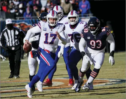  ?? CHARLES REX ARBOGAST — THE ASSOCIATED PRESS ?? Buffalo Bills quarterbac­k Josh Allen (17) in action against the Chicago Bears.