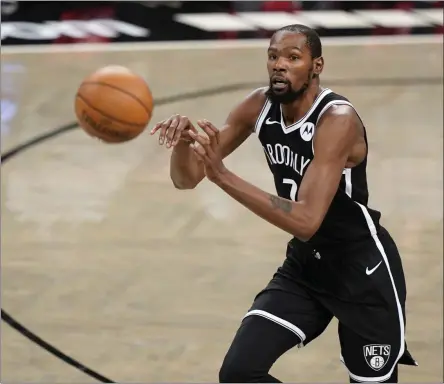  ?? KATHY WILLENS - THE ASSOCIATED PRESS ?? Brooklyn Nets forward Kevin Durant ( 7) passes during the first half of a preseason NBA basketball game against the Washington Wizards, Sunday, Dec. 13, 2020, in New York.