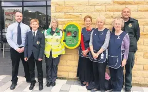  ??  ?? Pictured with the new Community Public Access Defibrilla­tor (cPAD) are, from left: Callum Boyle, Aldi Store Manager; Jack Buchanan; Dawn Taylor, Community Defibs for Rossendale Co-ordinator; Judith Fay, Pauline Greenwood and Jacqueline Mann, from Rossendale Tea Bar Service which donated funds towards the device and Richard Peters, Rossendale Community Specialist Paramedic