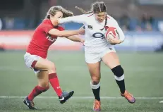  ?? PICTURE BYGETTY / RFU COLLECTION ?? Jess Breach holds off a Wales opponent