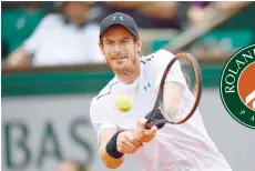 ?? — AFP ?? Britain’s Andy Murray returns the ball to Russia’s Karen Khachanov during their match at the Roland Garros 2017 French Open on Monday.