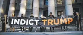  ?? DREW ANGERER/GETTY ?? Activists protest outside the federal court hearing on President Trump’s financial records