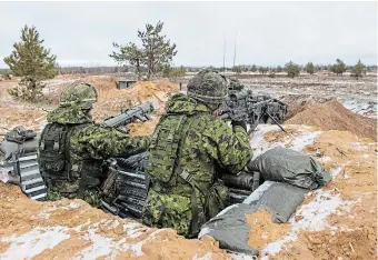  ?? PAULIUS PELECKIS GETTY IMAGES ?? Members of the Canadian Armed Forces during a military exercise on Monday in Adazi, Latvia.