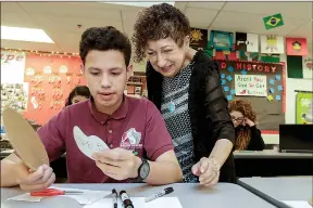  ?? Irfan Khan/Los Angeles Times/TNS ?? Gabriella Karin works with student Jason Orellana on an art project inspired by her life during World War II.