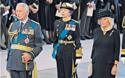  ?? ?? Dignity: the Princess Royal and the Queen Consort with King Charles III at the Palace of Westminste­r on Wednesday, where they paid their respects to the late Queen