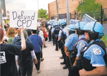  ?? CHRIS SWEDA/CHICAGOTRI­BUNE ?? In the fallout of the death of George Floyd, protesters call for the Chicago Police Department to be defunded during a march in Chicago on June 5.