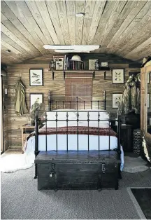  ??  ?? The bedroom is filled with campaign-style pieces and décor touches, such as ornitholog­ical drawings and maps. William pasted aviation charts above the bed showing routes to fly in the Western Cape. ‘Part of the dream was finding somewhere we could fly to,’ says Samantha.