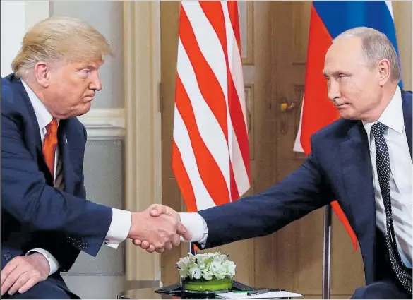  ??  ?? It is great to be with you... Donald Trump shakes Vladimir Putin’s hand at their meeting in the President Palace in Helsinki yesterday