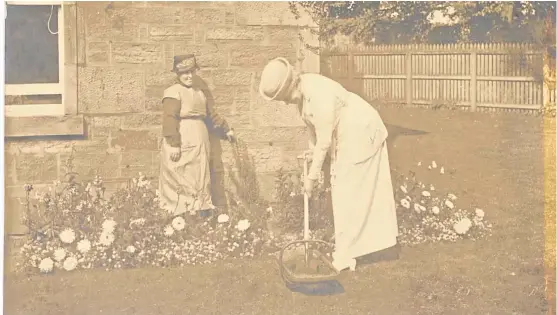  ??  ?? An Angus reader has provided this photograph of Queen Mary planting a tree at Annesley, Arbirlot Road, in September 1921.