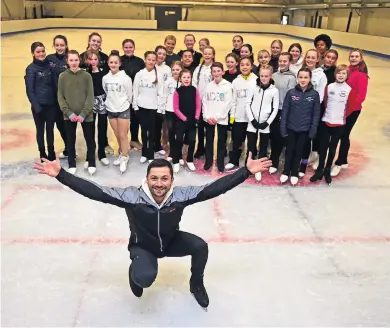  ?? ?? Inspiratio­n GB star Lewis Gibson is pictured during one of his coaching masterclas­ses with the lucky figure skaters