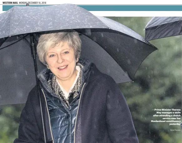  ?? Steve Parsons ?? &gt; Prime Minister Theresa May manages a smile after attending a church service near her Maidenhead constituen­cy yesterday