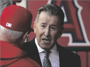  ?? AP PHOTO/MARK J. TERRILL ?? Los Angeles Angels owner Arte Moreno (right) talks with Angels manager Joe Maddon prior to a baseball game against the Cleveland Guardians, in 2022 in Anaheim, Calif.