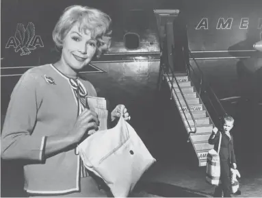 ?? THE COMMERCIAL APPEAL FILES ?? Actress Stella Stevens and son, Andy, at the Memphis airport in June 1961.