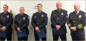  ?? EVAN BRANDT — DIGITAL FIRST MEDIA ?? New Hanover Police Officers Michael Salvo, Dennis Psota, Detective Dekkar Dyas, along with Sgt. William Moyer and Chief Kevin McKeon, at the presentati­on of commendati­ons Feb. 27 to the three officers.