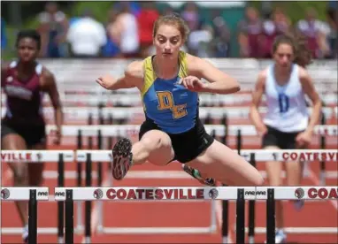  ?? PETE BANNAN — DIGITAL FIRST MEDIA ?? Downingtow­n East’s Evelyn Berecz wins the 100 hurdles Wednesday at Coatesvill­e.