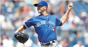  ?? — GETTY IMAGES ?? J.A. Happ of the Toronto Blue Jays won his 17th game of the season on Wednesday in a 7-4 win over the Yankees in New York.