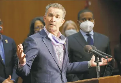  ?? STEVE HELBER/ASSOCIATED PRESS FILE ?? Gov. Ralph Northam announced Tuesday the state will step up enforcemen­t of mask and social distancing rules as coronaviru­s cases rise.