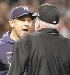  ?? AP ?? Aaron Boone gets his money’s worth after being ejected by umpire Paul Emmel during the seventh inning on Wednesday.