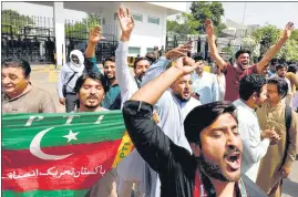  ?? REUTERS ?? PTI supporters raise slogans in support of PM Imran Khan in Islamabad.