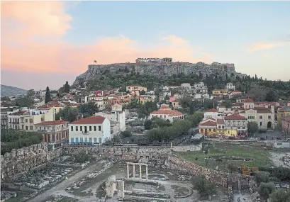  ?? EIRINI VOURLOUMIS THE NEW YORK TIMES ?? A view of the Plaka area and the Parthenon in Athens.