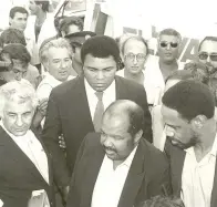  ?? "OESF #SVUNBOO +FSVTBMFN 1PTU BSDIJWFT ?? MUHAMMAD ALI (center) and his aides arrive at Israel’s Ben-Gurion Airport on June 27, 1985. The boxing-turned-global icon passed away over the weekend at the age of 74. him. He was the voice for us. He’s the voice for me to be where I’m at today.”...