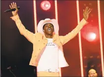  ?? Jason Kempin / TNS ?? Rapper Lil Nas X’s “Old Town Road” has engendered countless debates over what country music is. He performs onstage during the CMA Music Festival on June 8 in Nashville, Tenn.