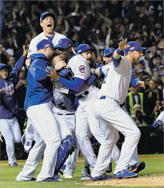  ?? Wally Skalij Los Angeles Times ?? IT’S A MOB SCENE at the mound as Cubs players celebrate after the final out of a 5-0 victory that clinched the franchise’s first World Series appearance in 71 years.