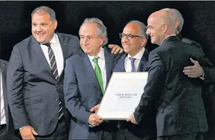  ?? AP PHOTO ?? Delegates of Canada, Mexico and the United States celebrate with FIFA President Gianni Infantino, right, on winning a joint bid to host the 2026 World Cup at the FIFA congress in Moscow, Russia, Wednesday. From left: Victor Montaglian­i, president of CONCACAF, Decio de Maria, President of the Football Associatio­n of Mexico, Carlos Cordeiro, U.S. soccer president, and Steve Reed, president of the Canadian Soccer Associatio­n (covered by Infantino).