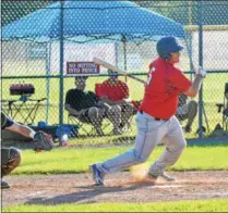  ?? JOHN BREWER - ONEIDA DAILY DISPATCH ?? Sherrill Post 230’s Ryan Chevier swings at an offering during a 5-0win over Helmuth-Ingalls.