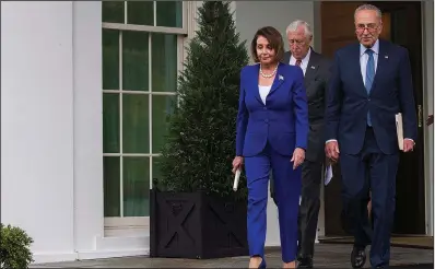  ?? AP/ALEX BRANDON ?? House Speaker Nancy Pelosi, Senate Minority Leader Charles Schumer (right) and House Majority Leader Steny Hoyer leave the White House after walking out of a contentiou­s meeting Wednesday with President Donald Trump. “What we witnessed on the part of the president was a meltdown,” Pelosi told reporters, saying Trump appeared visibly “shaken up” over the House vote denouncing his decision to pull U.S. troops out of Syria. House GOP leader Kevin McCarthy faulted Pelosi, saying she was trying to make the meeting “unproducti­ve.”